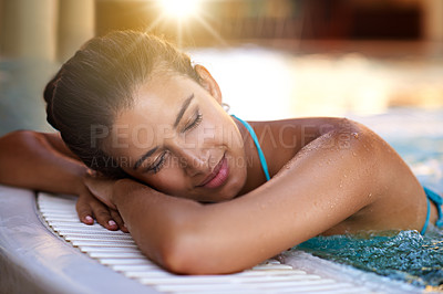 Buy stock photo Calm woman, relax and lying with water in jacuzzi for holiday, getaway or stress relief at hotel, resort or spa. Face of happy and young female person with smile in hot tub or warm pool on vacation