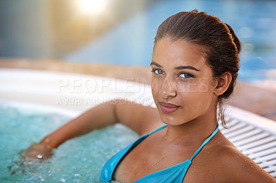 Buy stock photo Woman, portrait and happiness in jacuzzi at spa for luxury vacation, summer holiday and resort on weekend. Tourist, girl and face with smile in pool for swimming, fun getaway and wellness in bikini