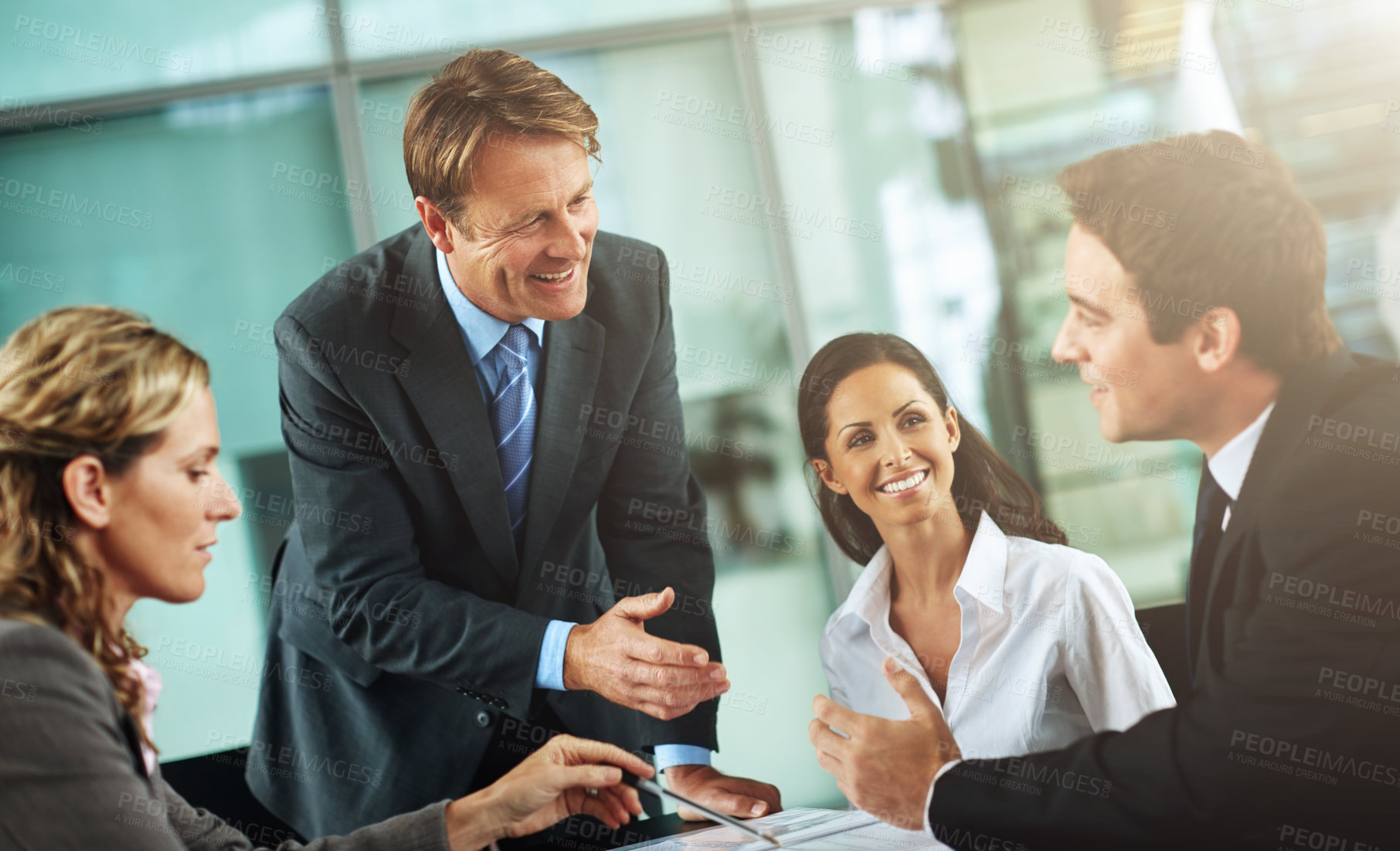 Buy stock photo Cropped shot of a group of businesspeople in a meeting