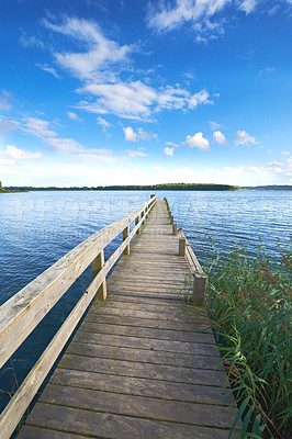 Buy stock photo Lake, bridge and blue sky in nature and clouds, water or landscape with outdoor plants. Wood, platform or river in countryside or adventure and structure or path for journey and travel for holiday  