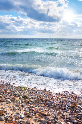 Buy stock photo Coast of Kattegat - Helgenaes, Denmark. Ocean waves washing onto empty beach shore stones. Calm peaceful paradise of summer seascape and sky for relaxing fun holiday abroad or travel vacation overseas