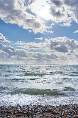 Buy stock photo Coast of Kattegat - Helgenaes, Denmark. Ocean waves washing onto empty beach shore stones. Calm peaceful paradise of summer seascape and sky for relaxing fun holiday abroad or travel vacation overseas