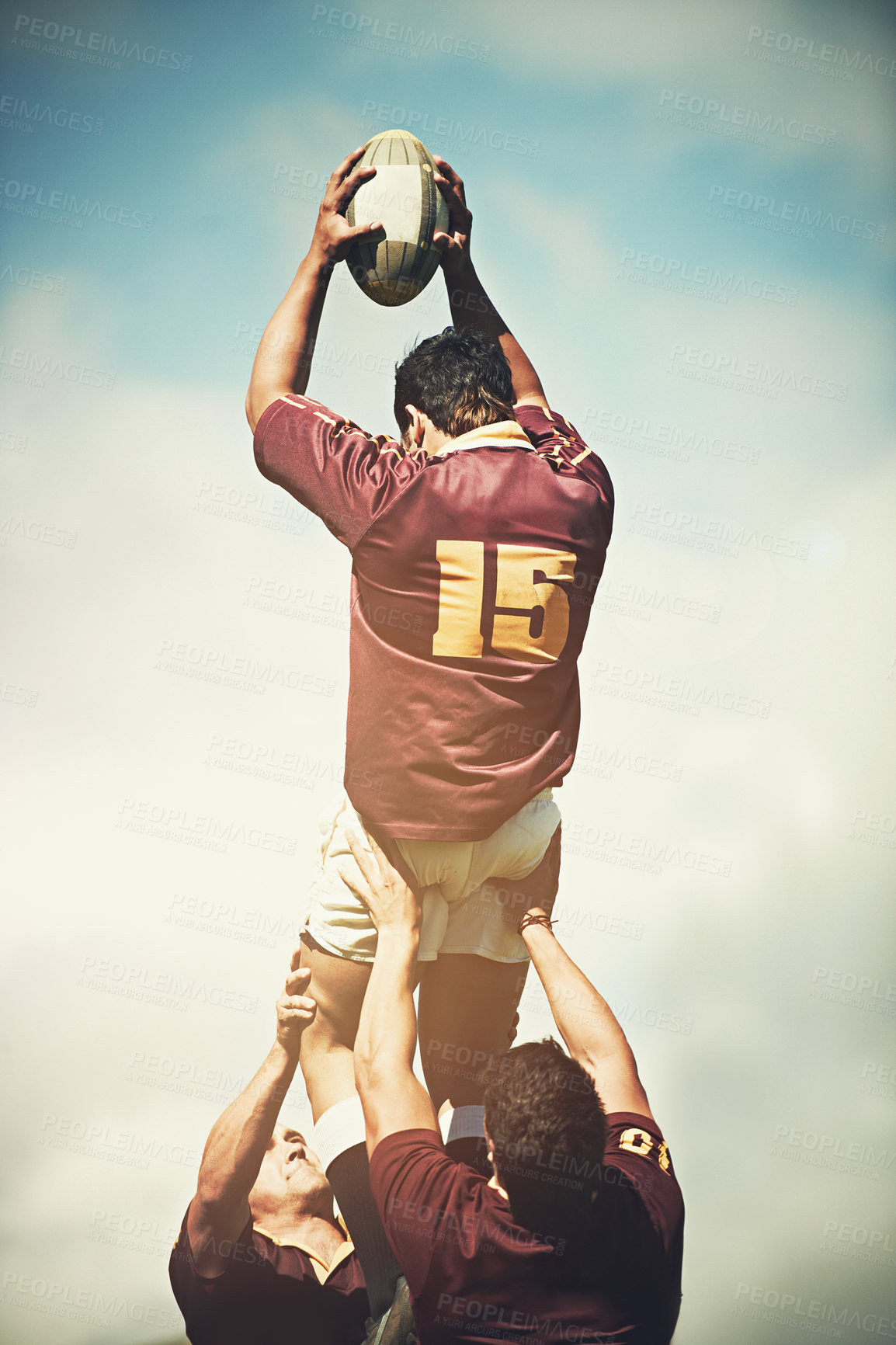 Buy stock photo Shot of a young rugby player catching the ball during a lineout