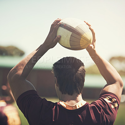 Buy stock photo Athlete, game and rugby ball on field for training, workout and exercise in summer for fitness. Sport, strong man and wellness for challenge, collaboration and back of professional college team.