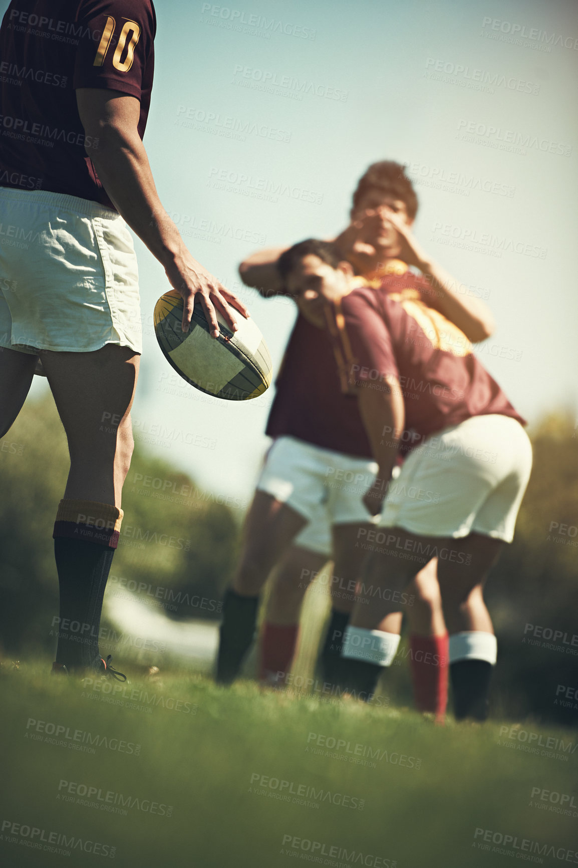 Buy stock photo Hand, rugby and team with ball on grass field for training together, competition and cardio workout. Group of athletes,  teamwork and sports uniform outdoor for practice game, sunshine and exercise