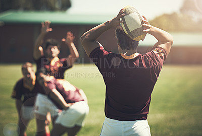 Buy stock photo Athlete, game and rugby ball on field for training, workout and exercise in summer for fitness. Sports, team and wellness for challenge, collaboration and compete for professional college player.