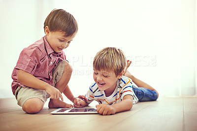 Buy stock photo Children, tablet and learning together in family home for fun and education. Male kids or friends laugh on floor while streaming internet for development with mobile app, online game or funny video