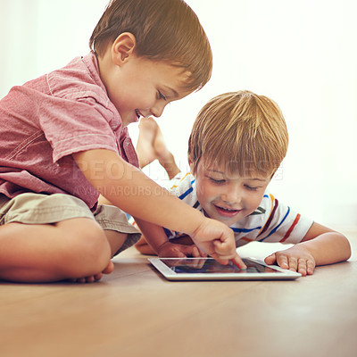 Buy stock photo Children, siblings and tablet on a floor with cartoon, gaming or streaming movie at home. Digital, learning and boy kids in house for google it, search or ebook storytelling, app or netflix and chill