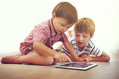 Buy stock photo Siblings, children and tablet on a floor with cartoon, gaming or streaming movie at home. Digital, learning and boy kids in house for google it, search or ebook storytelling, app or netflix and chill