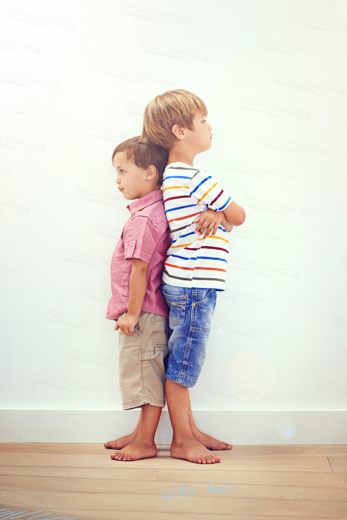 Buy stock photo Two little boys standing back to back