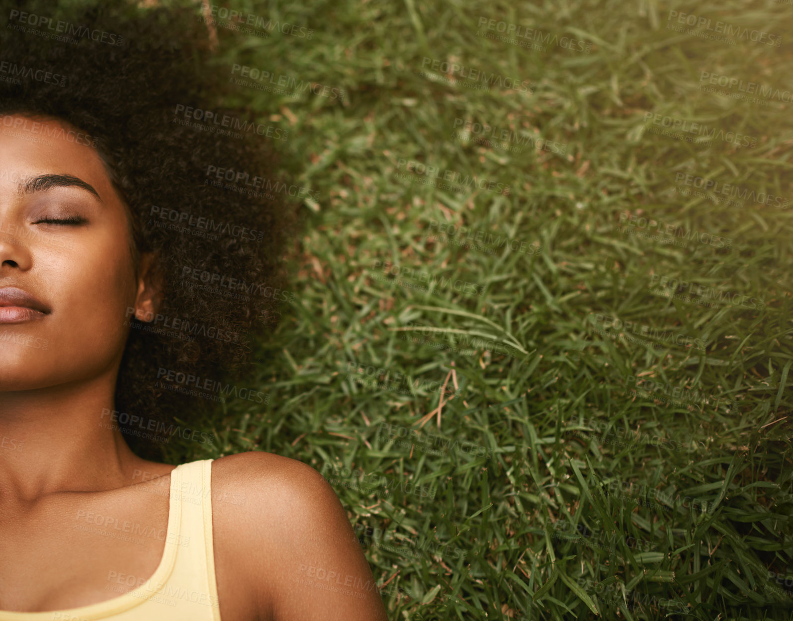Buy stock photo Sleep, grass and mockup with a black woman lying on a field from above for peace or quiet outdoor in nature. Dreaming, relax and zen with an attractive young female resting alone in the countryside