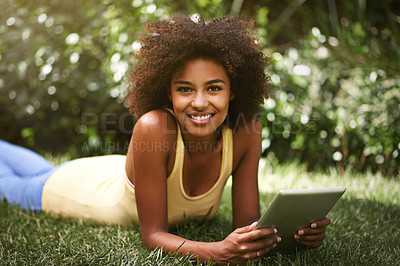 Buy stock photo African woman, tablet and portrait on grass to relax, contact and smile for post on web blog. Girl, digital touchscreen and happy in backyard, garden and outdoor with app for social network in Brazil