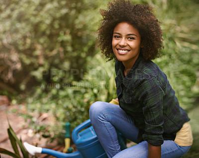 Buy stock photo Woman, gardening and portrait with water can, plants and happy for spring, outdoor and earth. Girl, African person and smile on ground for growth, development and nature with ecology in backyard