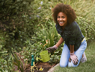 Buy stock photo Woman, gardening and water can on ground with smile for plants in spring, outdoor or care on grass. Girl, African person and happy with earth for growth, development or nature for ecology in backyard