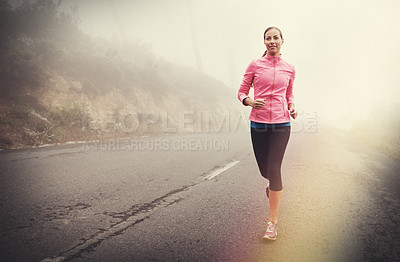 Buy stock photo Nature, health and woman running in fog on mountain road for race, marathon or competition training. Sports, exercise and athlete with cardio workout for fitness in misty outdoor woods or forest.