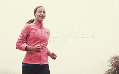 Buy stock photo Nature, energy and woman athlete running on mountain road for race, marathon or competition training. Sports, exercise and female with cardio workout for fitness in misty outdoor woods or forest.