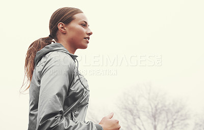 Buy stock photo Nature, health and woman athlete running on mountain road for race, marathon or competition training. Sports, exercise and person with cardio workout for fitness in misty outdoor woods or forest.