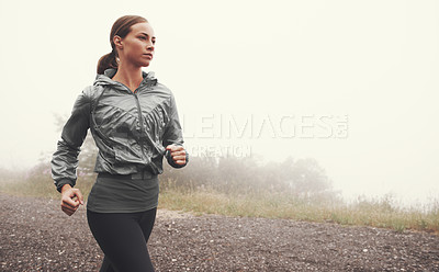 Buy stock photo Fog, fitness and woman running on road outdoor for healthy body, wellness and training for sports on mockup space in winter. Mist, exercise and person workout for cardio, race and energy in nature