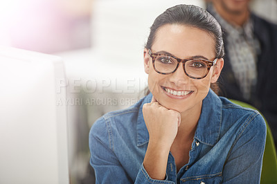 Buy stock photo Cropped portrait of a young businesswoman at her desk