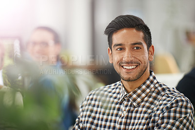 Buy stock photo Cropped shot of a young businessman at his dek