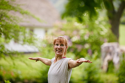 Buy stock photo Shot of a woman doing yoga in the park