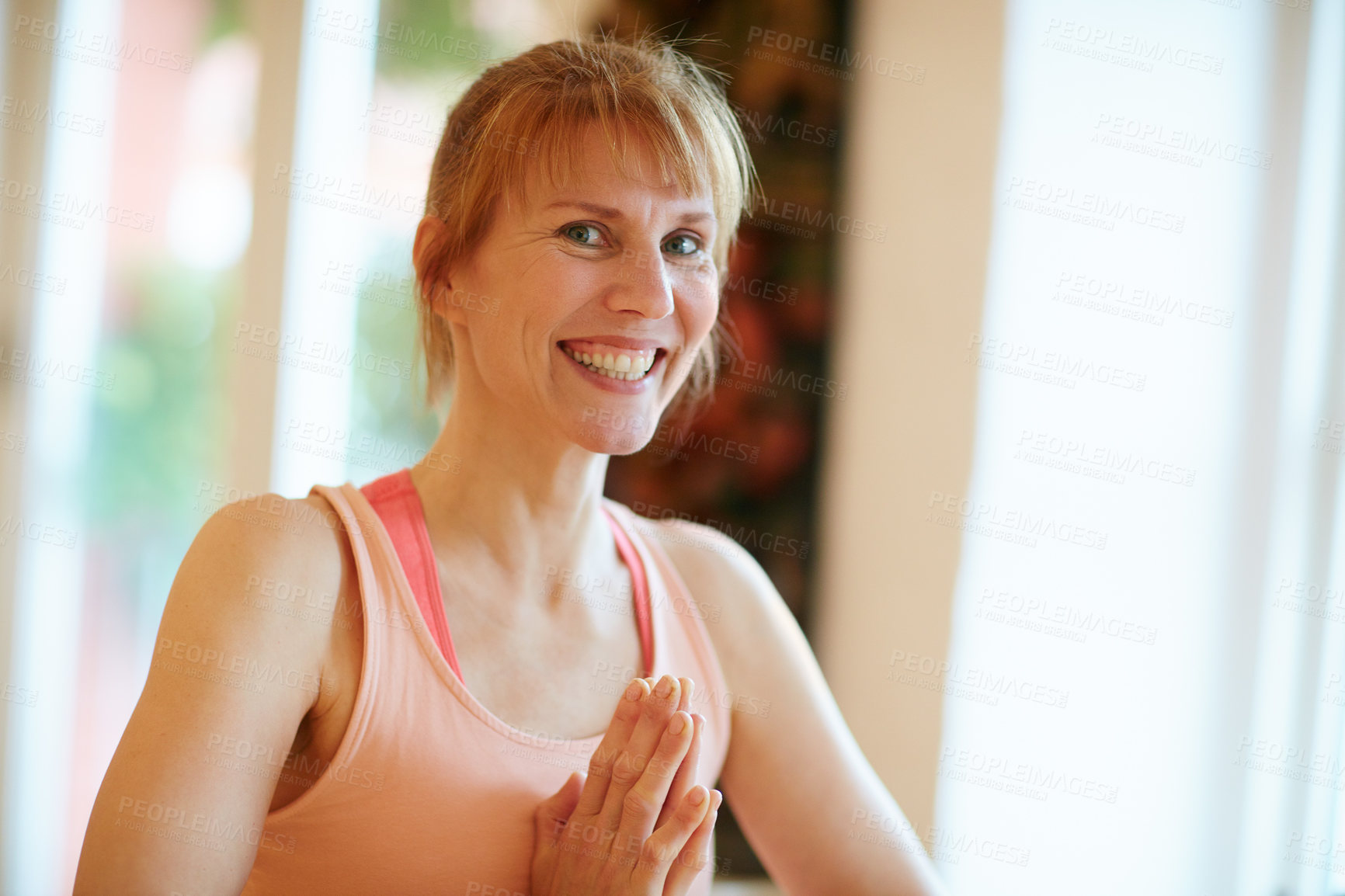 Buy stock photo Shot of a woman doing yoga indoors