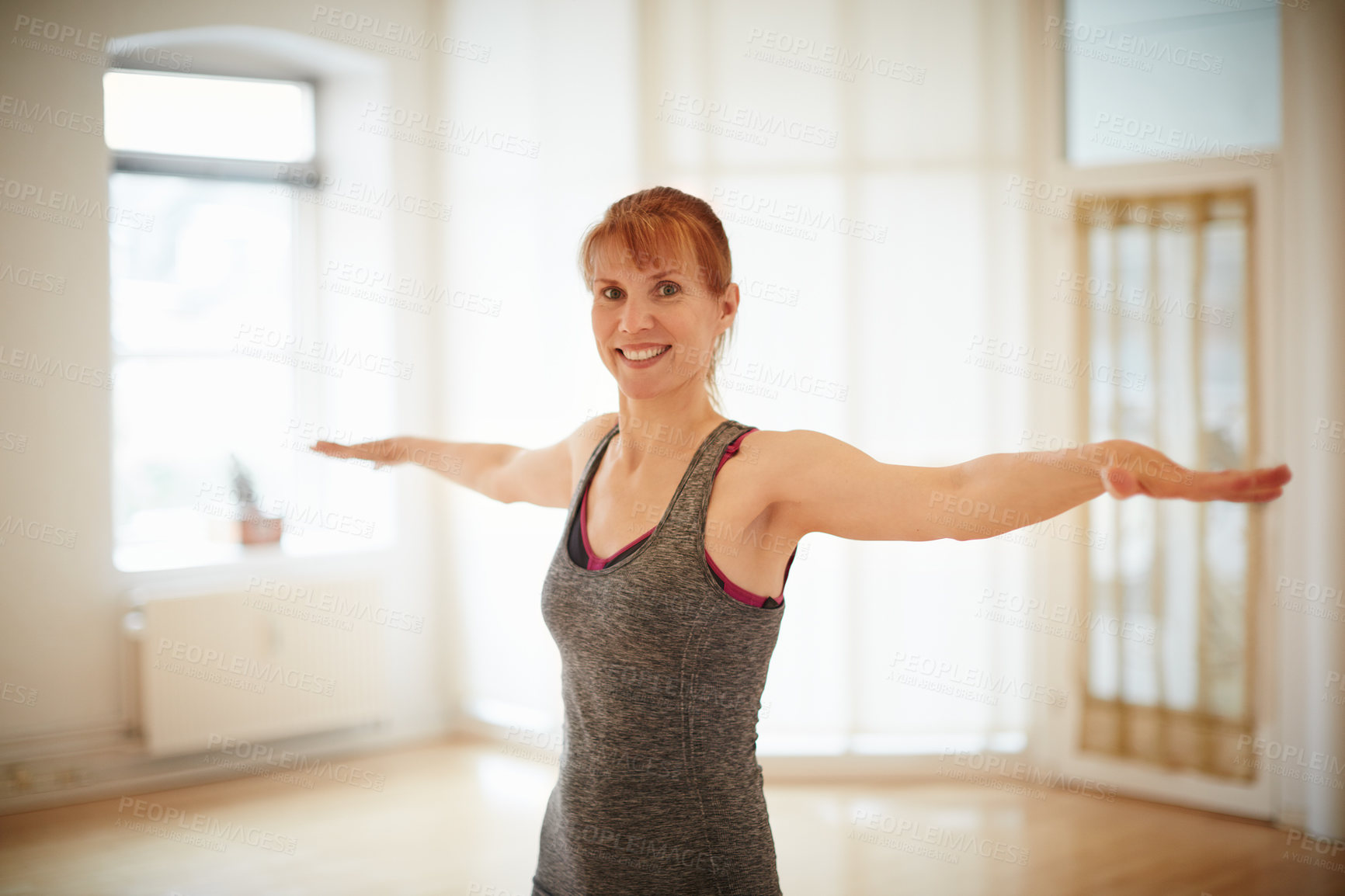 Buy stock photo Shot of a woman doing yoga indoors