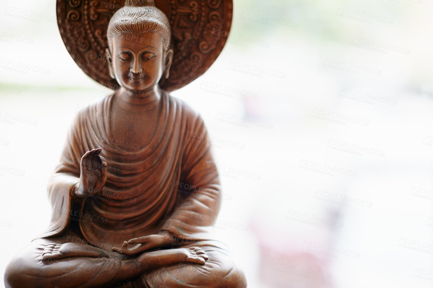 Buy stock photo Shot of a statue of a meditating Buddha