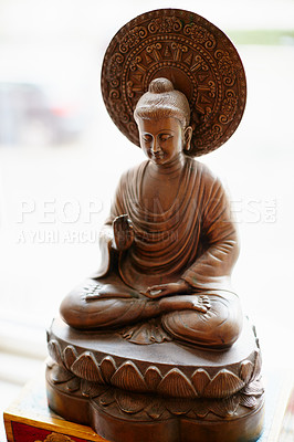 Buy stock photo Shot of a statue of a meditating Buddha