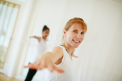 Buy stock photo Shot of a woman doing a yoga class