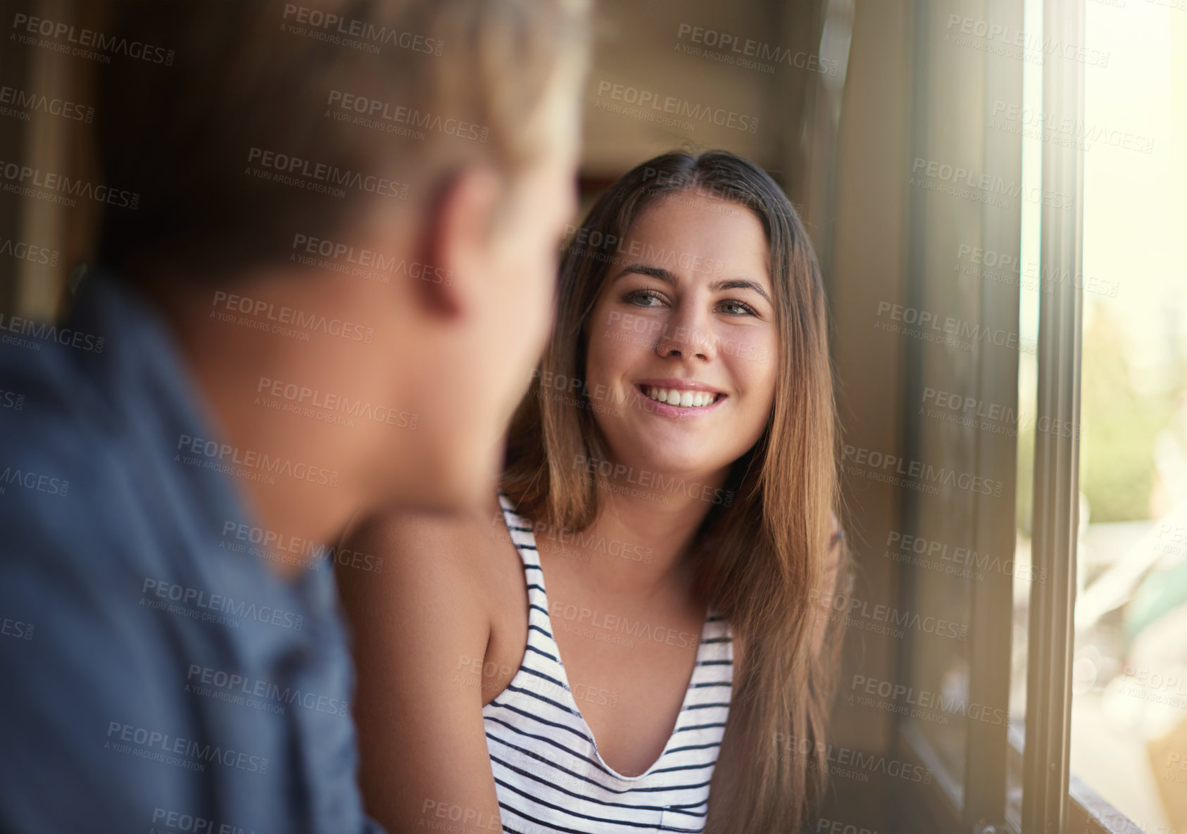 Buy stock photo Face, smile and couple at window of coffee shop together for bonding, conversation or dating. Love, happy or romance and young man and woman in cafe or restaurant to relax on weekend morning