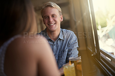 Buy stock photo Conversation, happy couple and drinking beer in pub, relax and leisure together in restaurant with alcohol. Smile, man and woman talk at bar for connection, relationship or bonding on a date at club