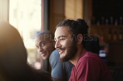 Buy stock photo Face, smile and man with friends in coffee shop together for conversation or bonding on weekend. Customer, relax and summer with group of happy young friends in cafe or restaurant for time off