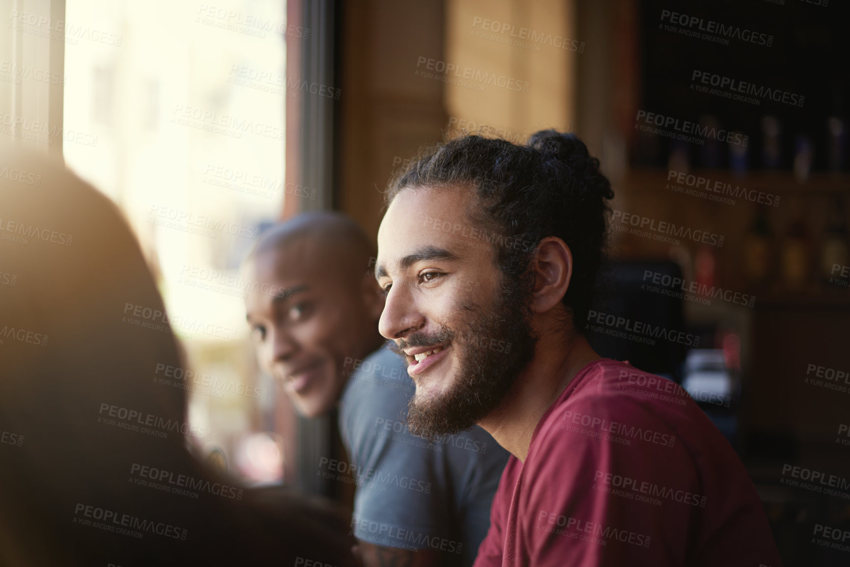 Buy stock photo Face, smile and man with friends in coffee shop together for conversation or bonding on weekend. Customer, relax and summer with group of happy young friends in cafe or restaurant for time off