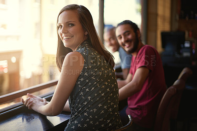 Buy stock photo Friends, woman and portrait at cafe, smile and relax indoor for fun and bonding in sunset to diverse. People, bistro and sitting for social, guys and joy together and laughing for fun and weekend.