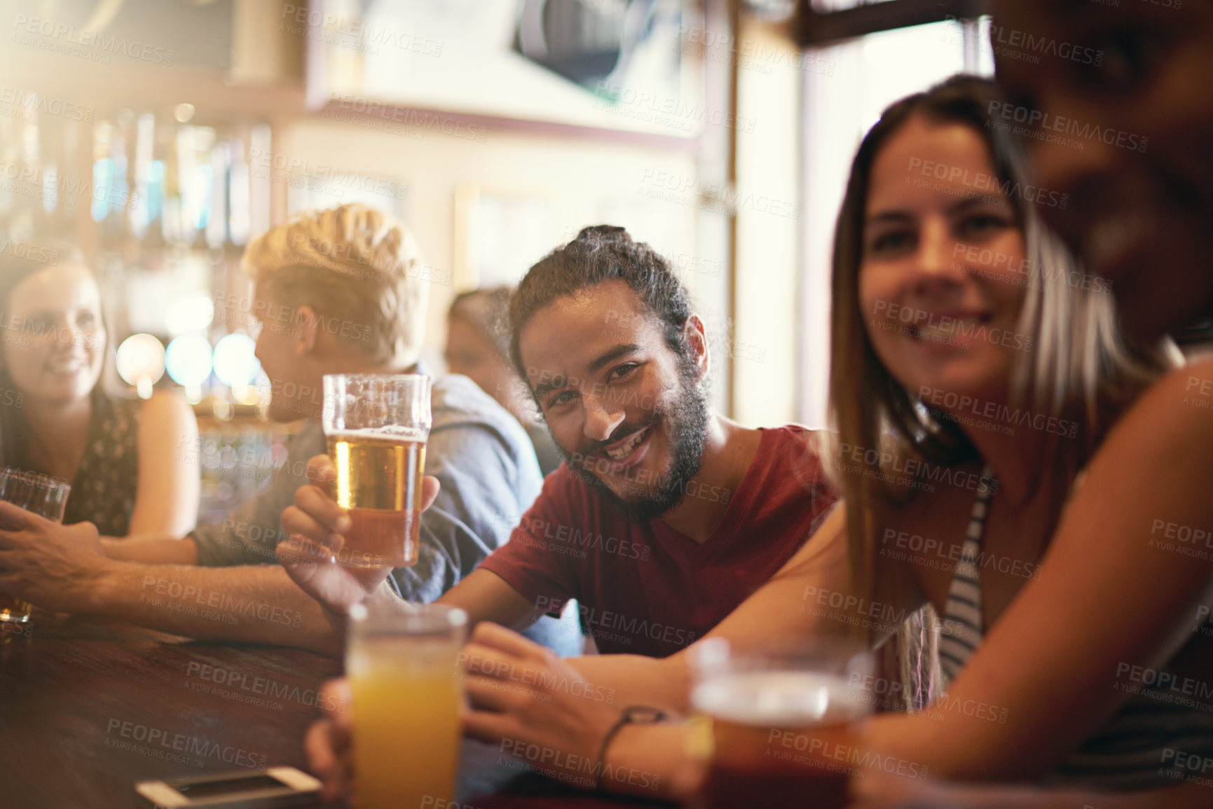 Buy stock photo Friends, man and smile in pub with beer for happy hour, relax or social event with confidence. Diversity, people and drinking alcohol in restaurant or club with discussion for bonding and celebration
