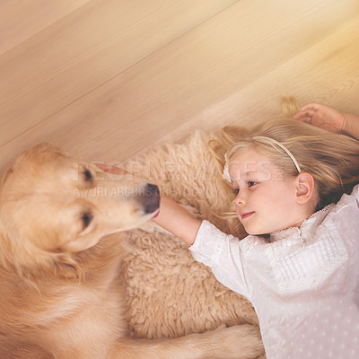 Buy stock photo Girl, dog and relax together for bonding, care and pet for support on floor of living room in home. Child, golden retriever and stroke a puppy on mockup space, top view and companion in childhood