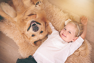 Buy stock photo Girl, dog and portrait together on floor in living room or golden retriever, kid and smiling with pet above lounge carpet. Young child, Labrador and happiness or family home, pets and top view