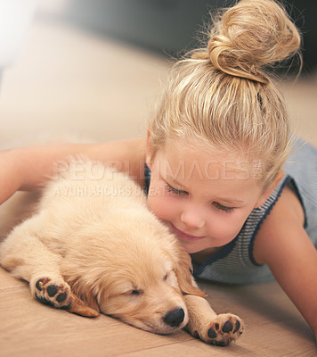 Buy stock photo Girl child hug her puppy, relax at home and happy with sleeping golden retriever dog, friends and peace. Pet care, love and young, calm female kid with her domestic animal lying on wood floor