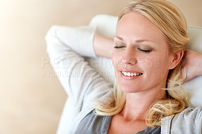 Buy stock photo Shot of a woman relaxing at home