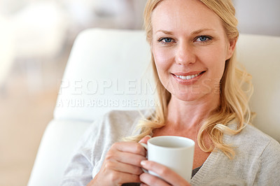 Buy stock photo Portrait of a woman enjoying a cup of coffee at home