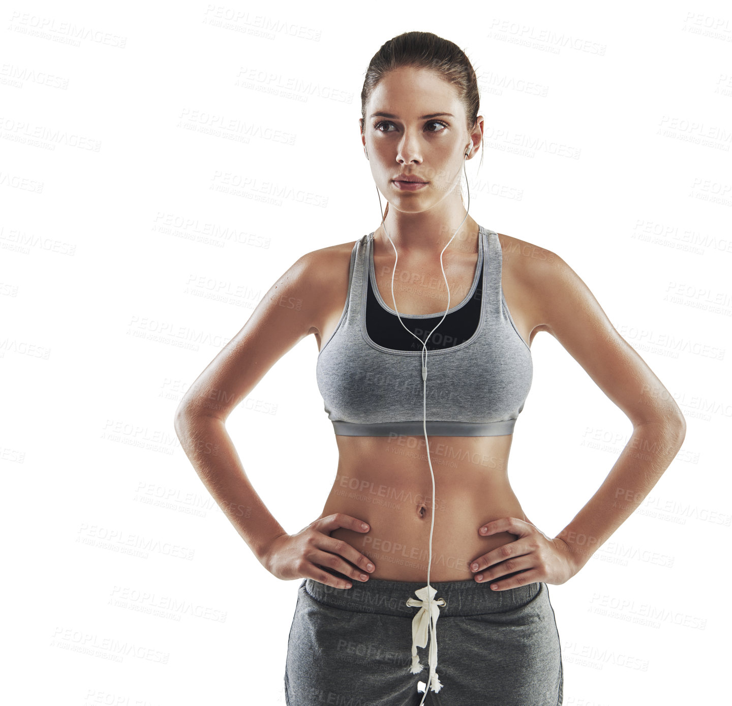 Buy stock photo Cropped shot of a young female athlete standing arms akimbo against white background