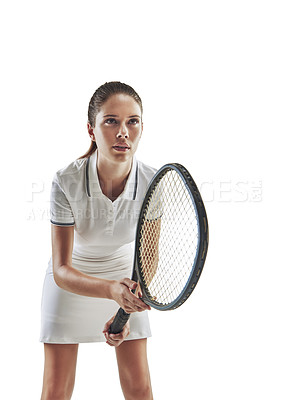 Buy stock photo Studio shot of a female tennis player holding a racket against a white background