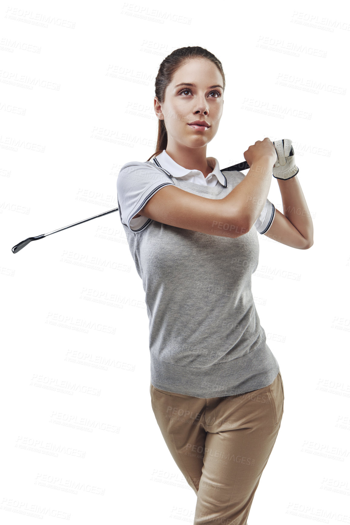 Buy stock photo Studio shot of a young golfer practicing her swing isolated on white