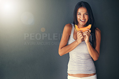 Buy stock photo Slice of melon, portrait and hungry with woman, healthy snack and person on grey background. Face, model and girl eating a fruit, wellness and mockup space with diet plan and food with treat or detox