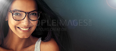 Buy stock photo Studio portrait of an attractive young woman wearing glasses