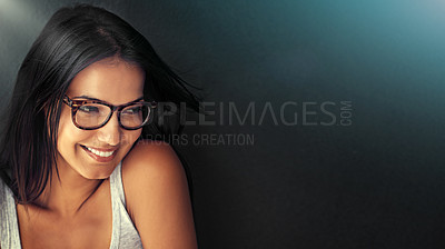 Buy stock photo Studio portrait of an attractive young woman wearing glasses