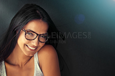 Buy stock photo Woman, face and happy with glasses and vision with designer frame with prescription lens on studio background. Portrait, eye care and female model with fashion eyewear, optometry and mockup space
