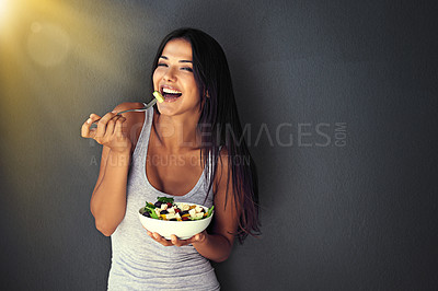 Buy stock photo Happy woman is eating a salad, healthy food and nutrition, portrait and vegetables isolated on wall background. Organic, vegan and health with diet, female model to lose weight with mockup space