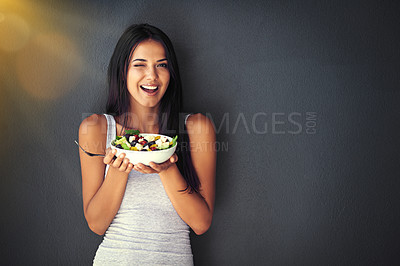 Buy stock photo Woman wink with salad, healthy food and nutrition, portrait and vegetables isolated on wall background. Happy, body and health with wellness, diet and female model to lose weight with mockup space